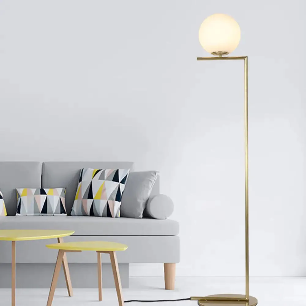 Minimalist Gold Orb Floor Lamp with Frosted Glass Shade and Right Angle Stand